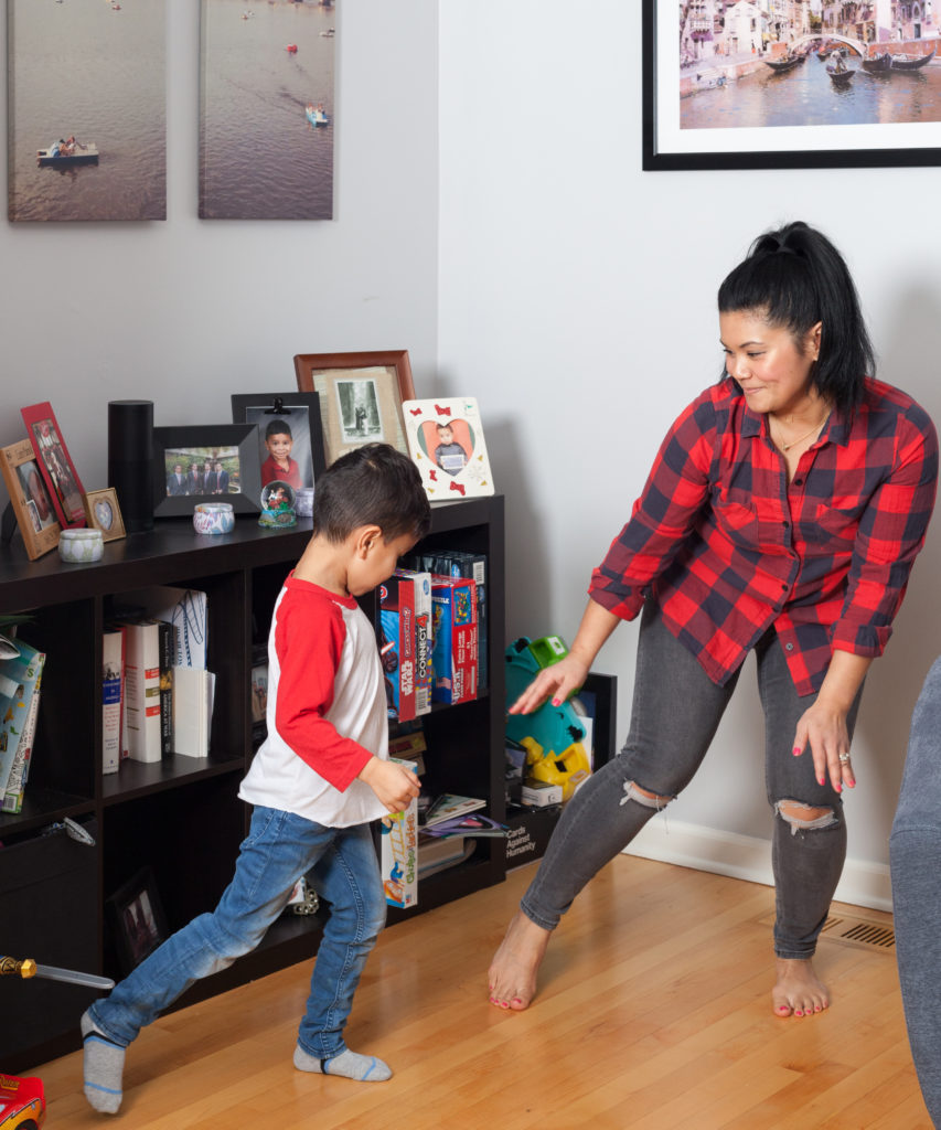 happy kid dancing with his mom 